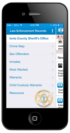 An image of a smartphone with a screen shot of the MobilePatrol application on screen.