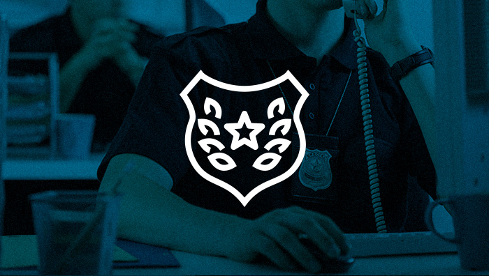 A graphic with a blue color overlaying an image of a detective on the phone. There is a badge icon overlaying the image.