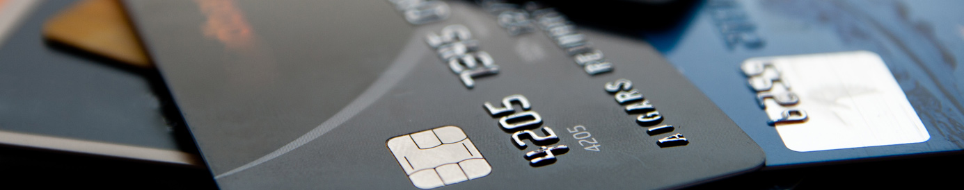 Credit cards spread across a laptop keyboard