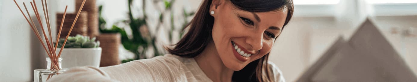 A woman looking down and smiling