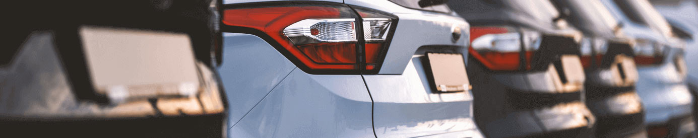 A line of cars parked next to each other