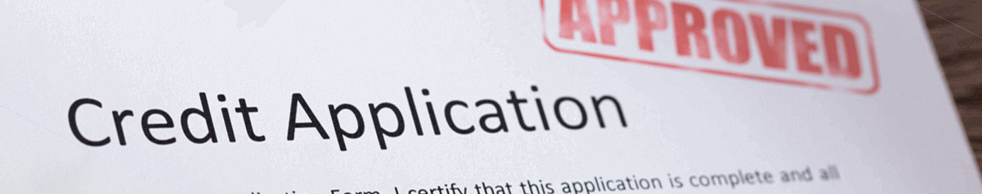 A credit application form with the word APPROVED stamped in the upper right hand corner