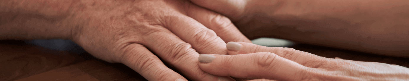 Two people touch their hands together