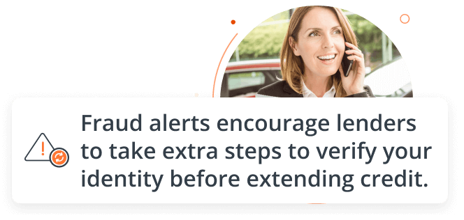 woman holding a clip board talking on her telephone