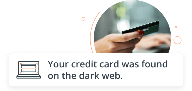 woman holding a credit card at her computer