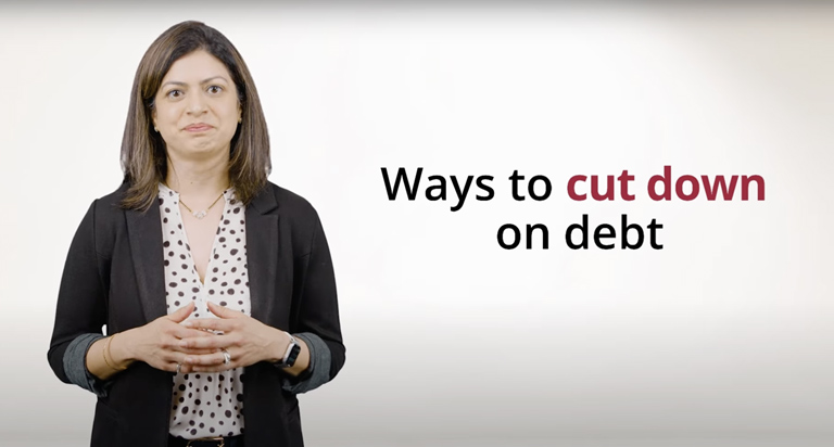 A woman with dark hair and a black suit, with hands clasped, stands next to text that reads: “Ways to Cut Down on Debt”.