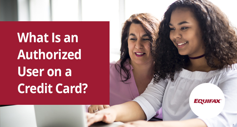 Two smiling women sit in front of a laptop while one types. The text “What Is an Authorized User on a Credit Card?”.