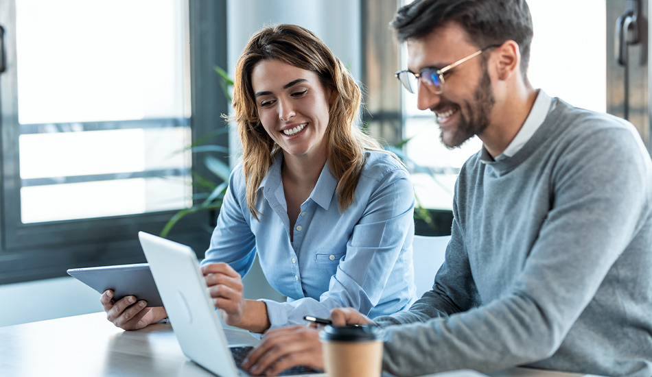 Teammates checks data on the laptop