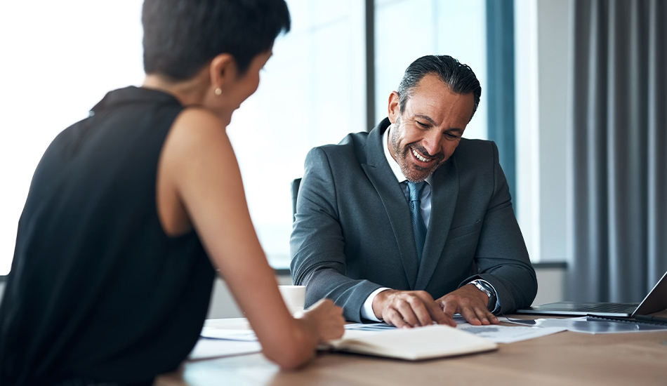 Executives pointing data at on document