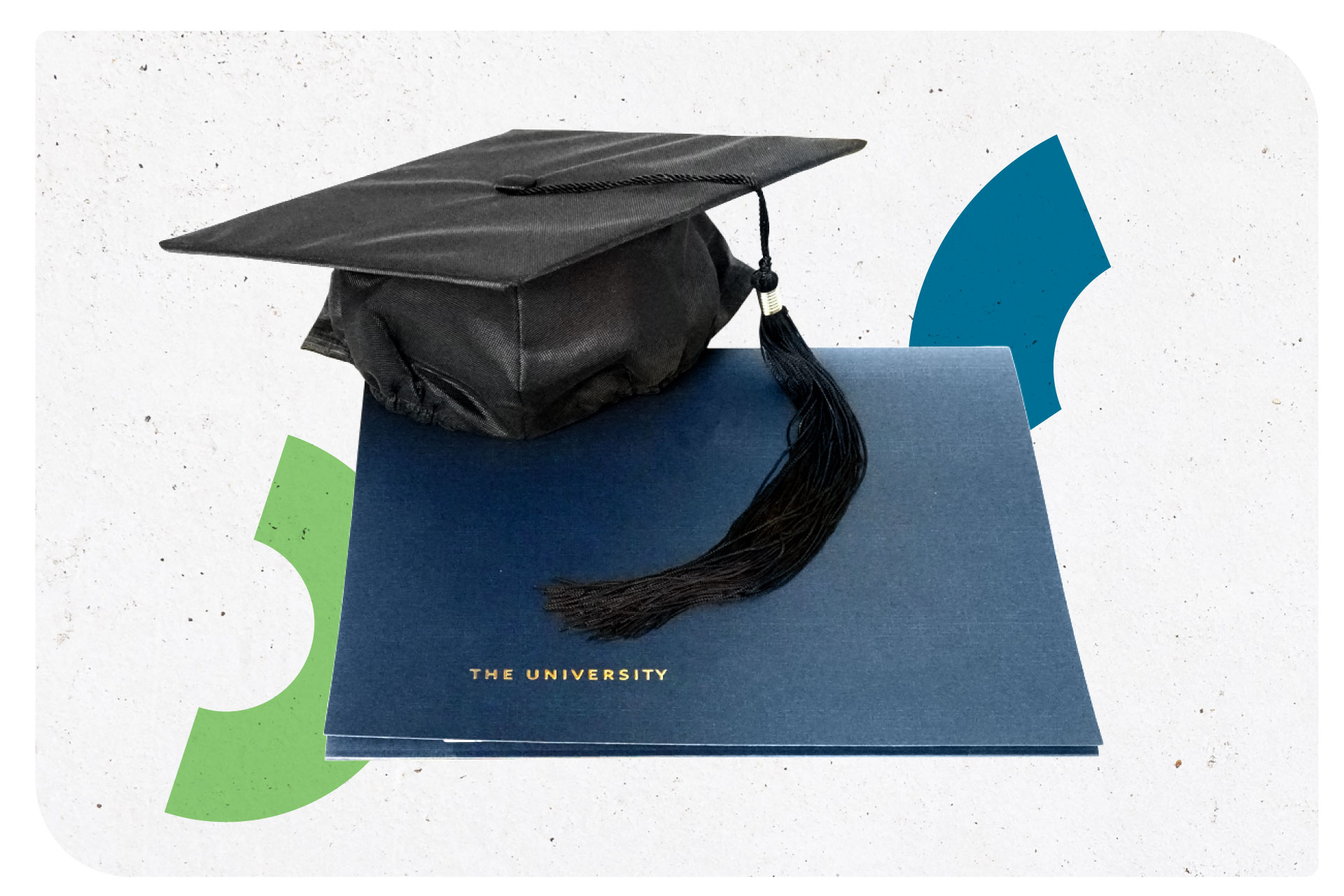 A graduation cap sitting on a diploma